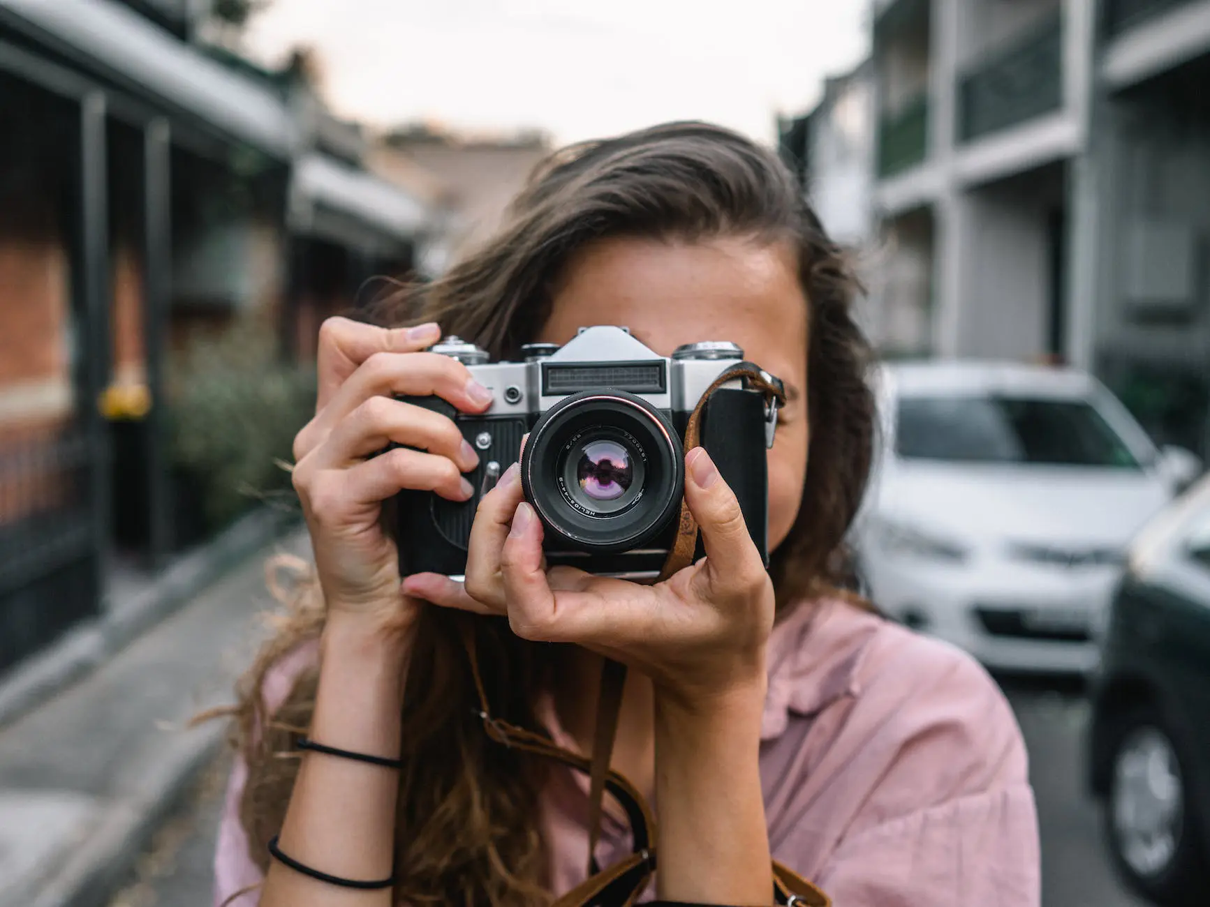 woman using slr camera